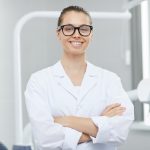 female-dentist-posing-in-office-H89D7UA.jpg