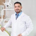 middle-eastern-dentist-posing-by-chair-3WJ4MEV.jpg